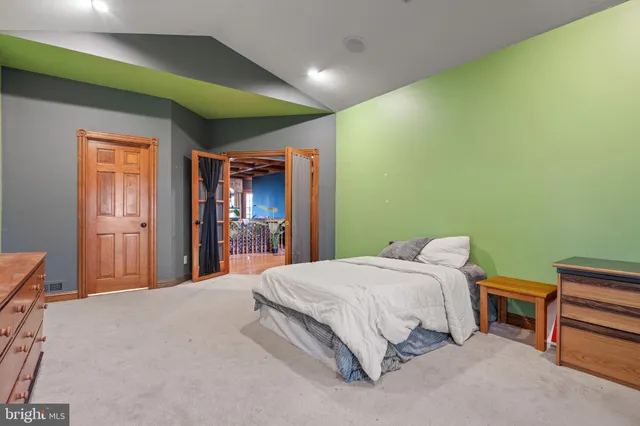 a white house that has a tree in front of it