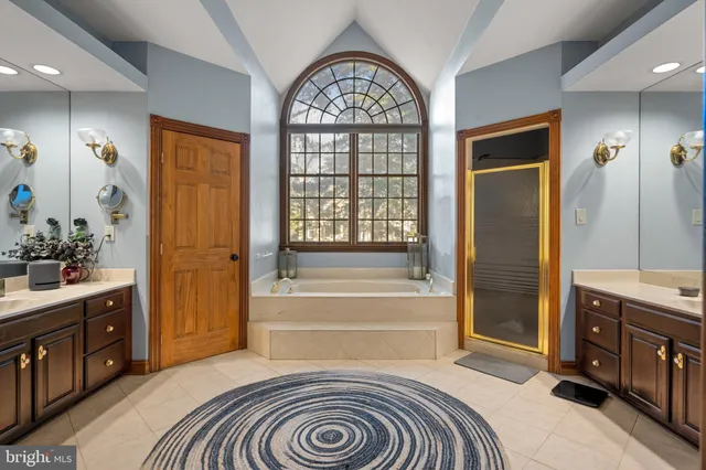 a bathroom with a tub and a window