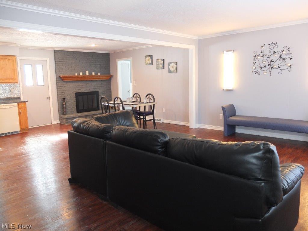 3262 Boyne Road Barberton, OH 44203 - Photo 6 of 20 Living room is open to the dining room and kitchen.