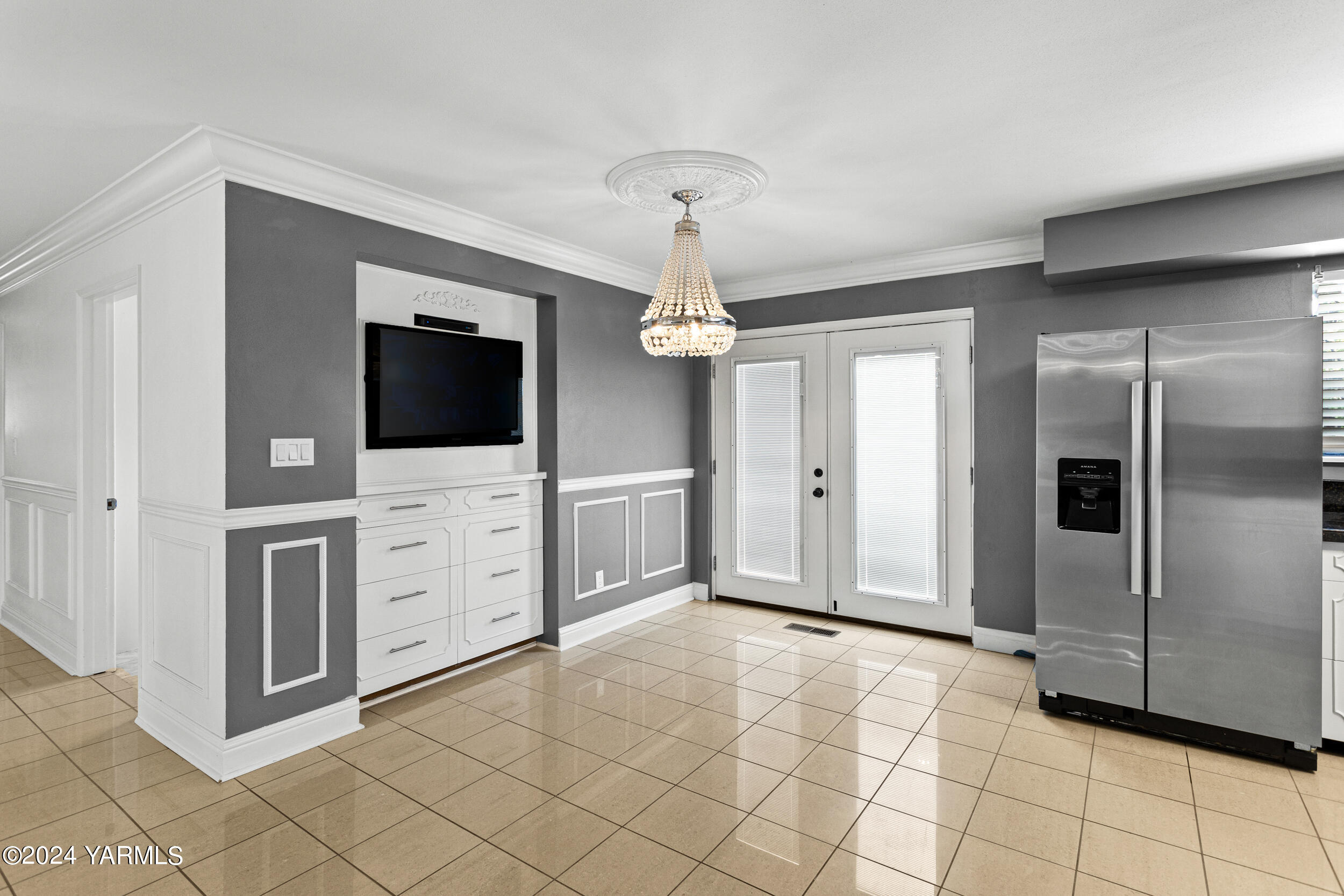 531 McDonald Road Toppenish, WA 98948 - Photo 19 of 78 a view of a livingroom with an empty space and a flat screen tv