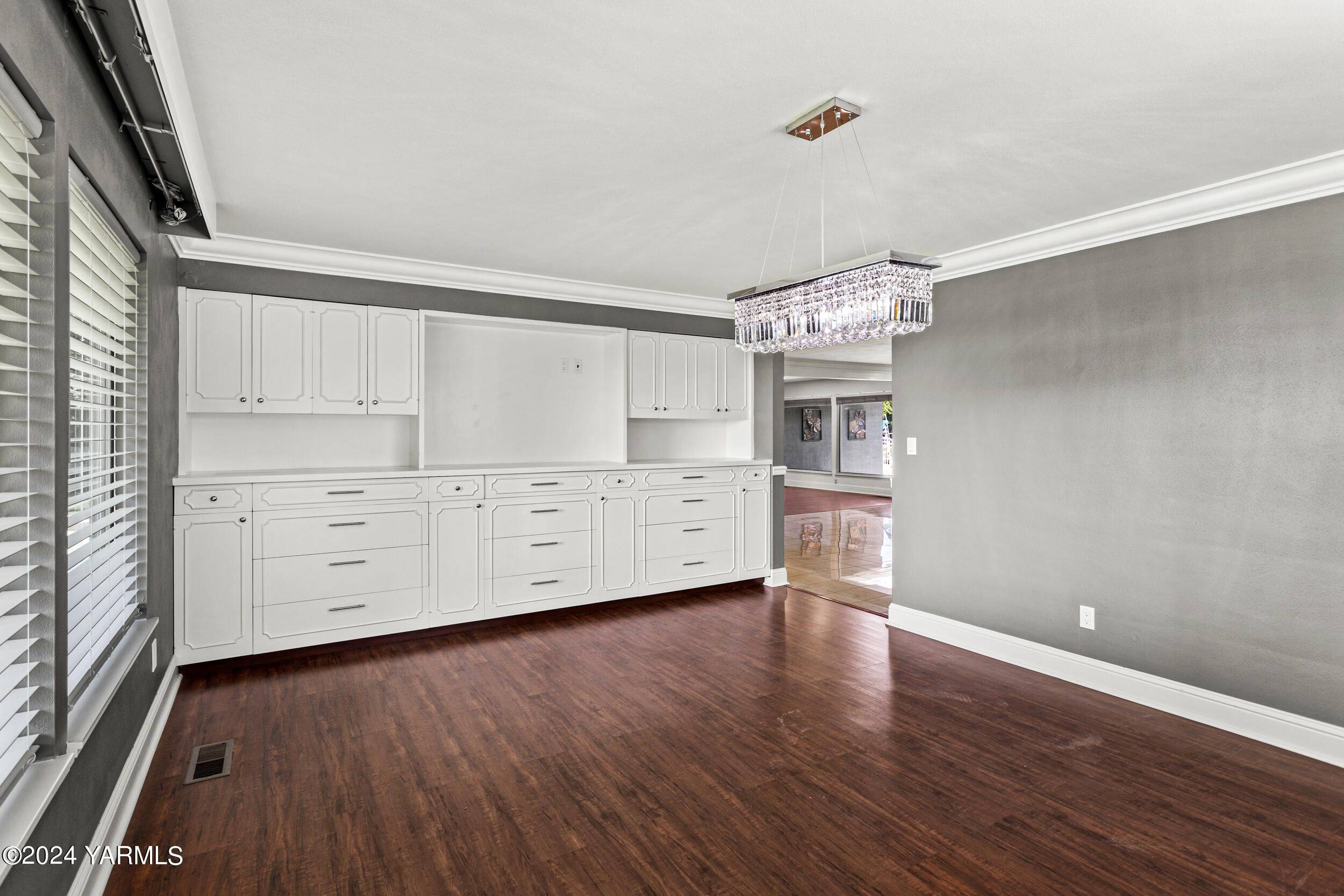 531 McDonald Road Toppenish, WA 98948 - Photo 21 of 78 a view of an empty room with a window and wooden floor