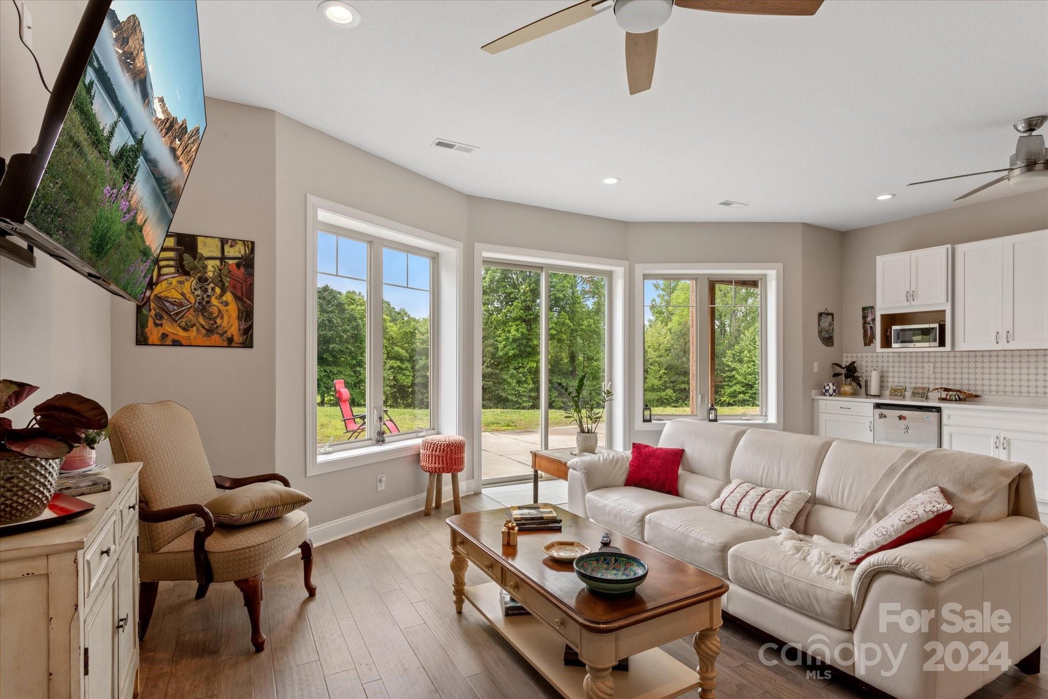 464 Hooper Creek Road Tryon, NC 28782 - Photo 13 of 24 a living room with furniture and a large window