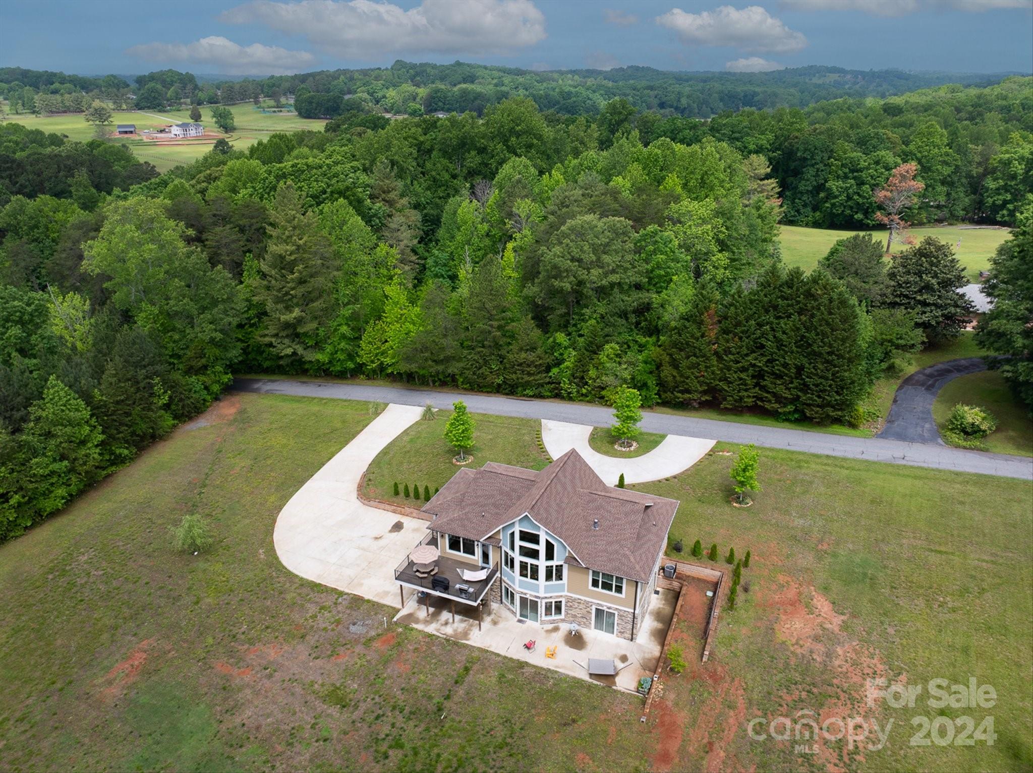 464 Hooper Creek Road Tryon, NC 28782 - Photo 19 of 24 an aerial view of a house with a swimming pool