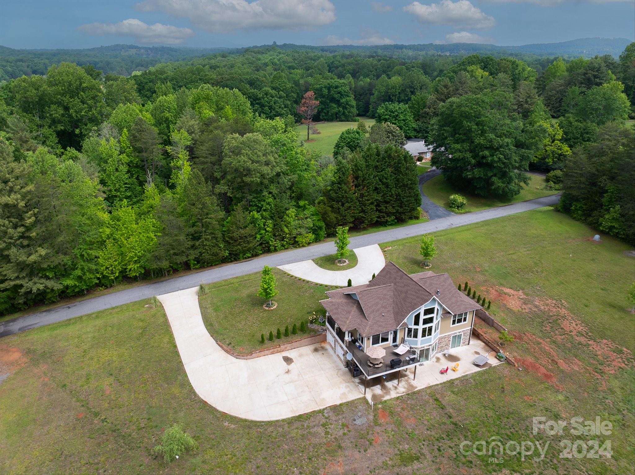 464 Hooper Creek Road Tryon, NC 28782 - Photo 20 of 24 an aerial view of a house with a yard