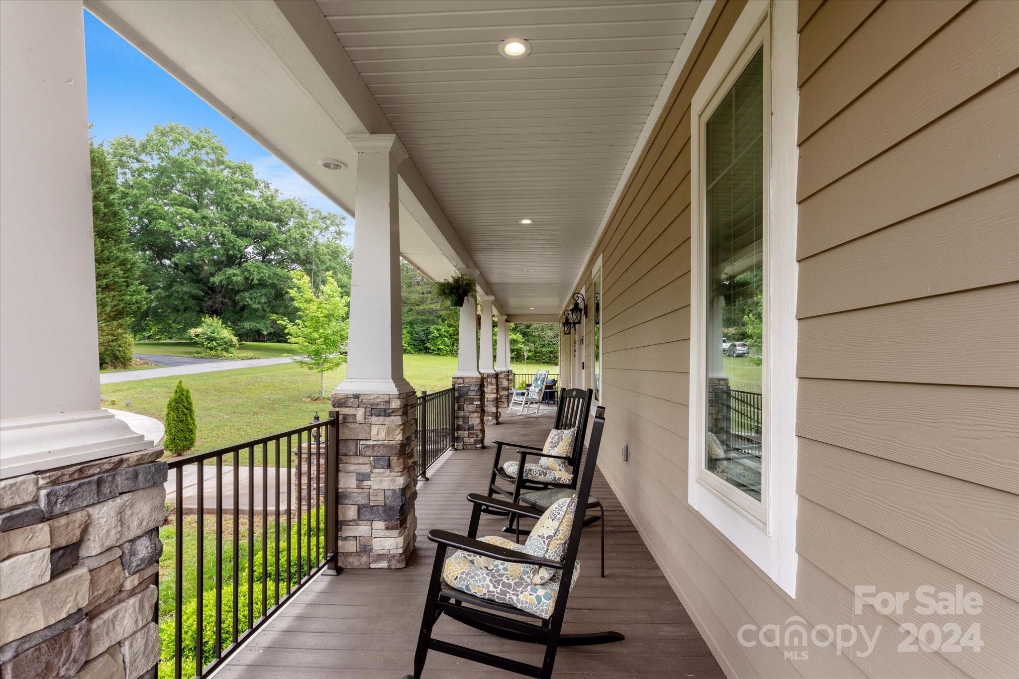 464 Hooper Creek Road Tryon, NC 28782 - Photo 3 of 24 a view of a two chairs in the balcony