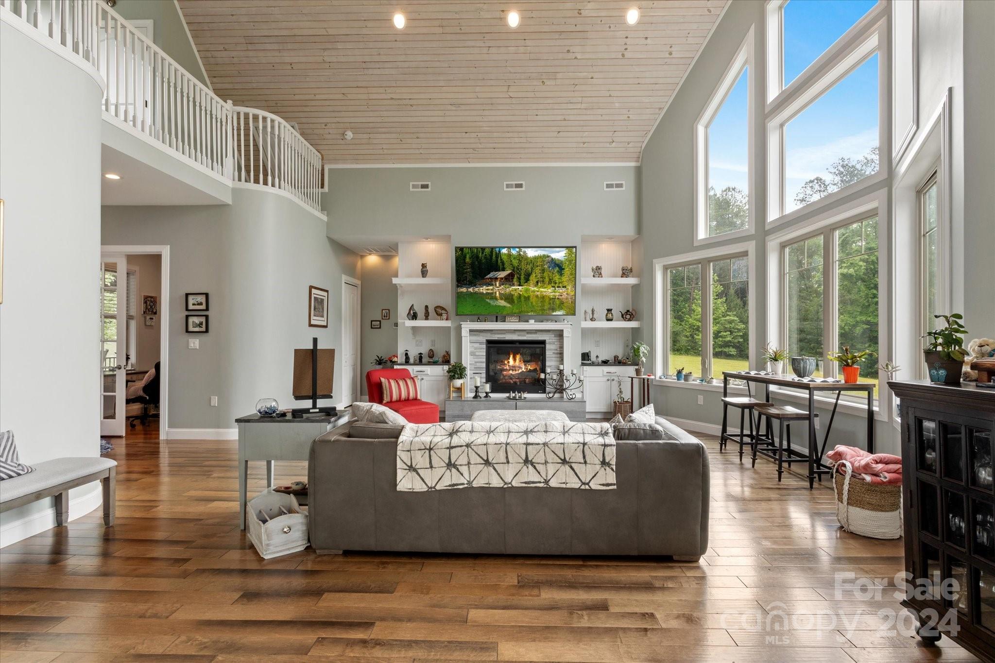 464 Hooper Creek Road Tryon, NC 28782 - Photo 5 of 24 a living room with fireplace furniture and a large window