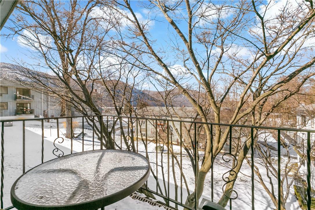 44 Fair Street, Unit E4 Cold Spring, NY 10516 - Photo 1 of 1 a backyard of a house with fountain table and chairs