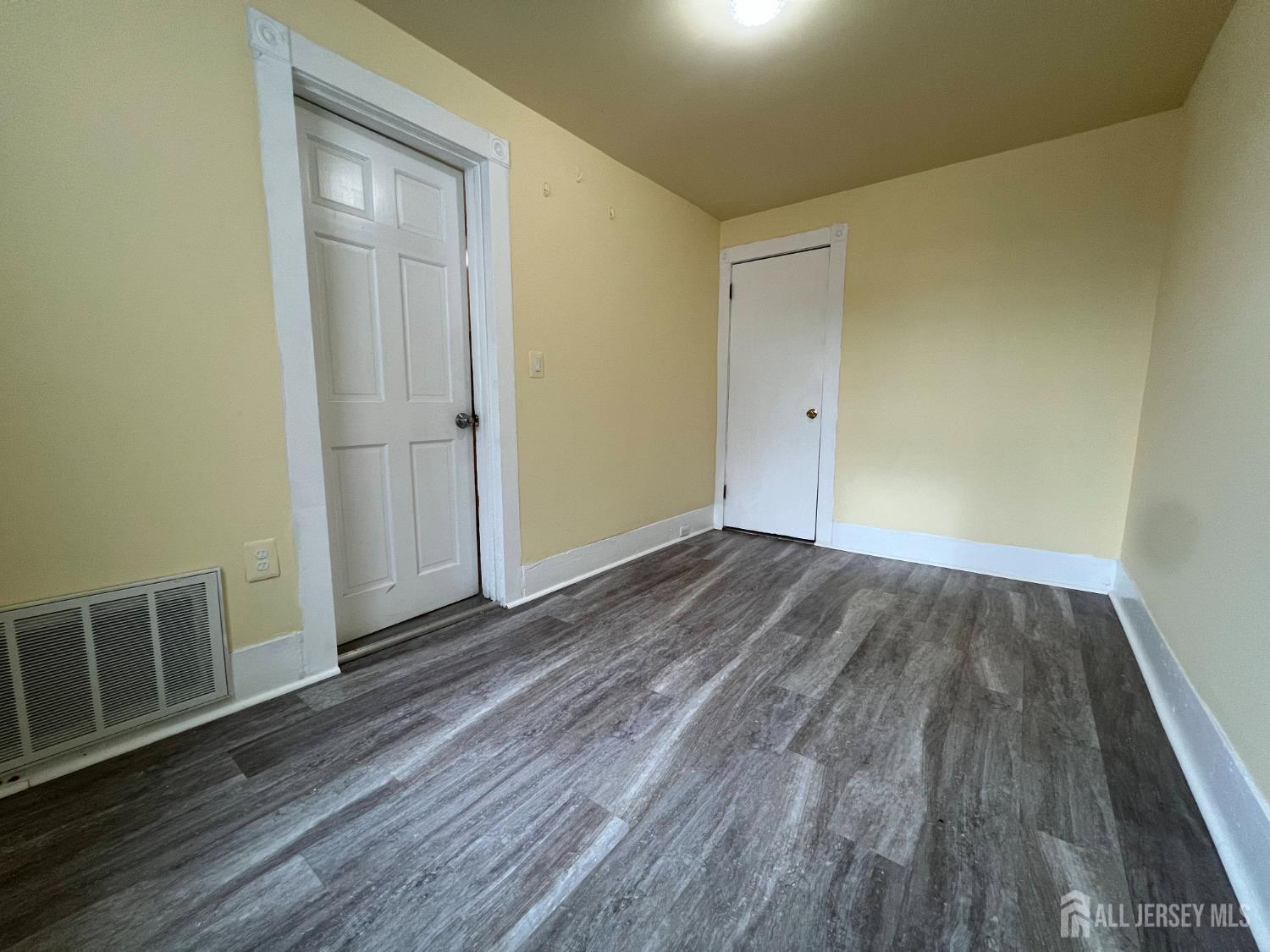 109 Washington Street, Unit 2 Perth Amboy, NJ 08861 - Photo 12 of 15 a view of a room with wooden floor and entryway