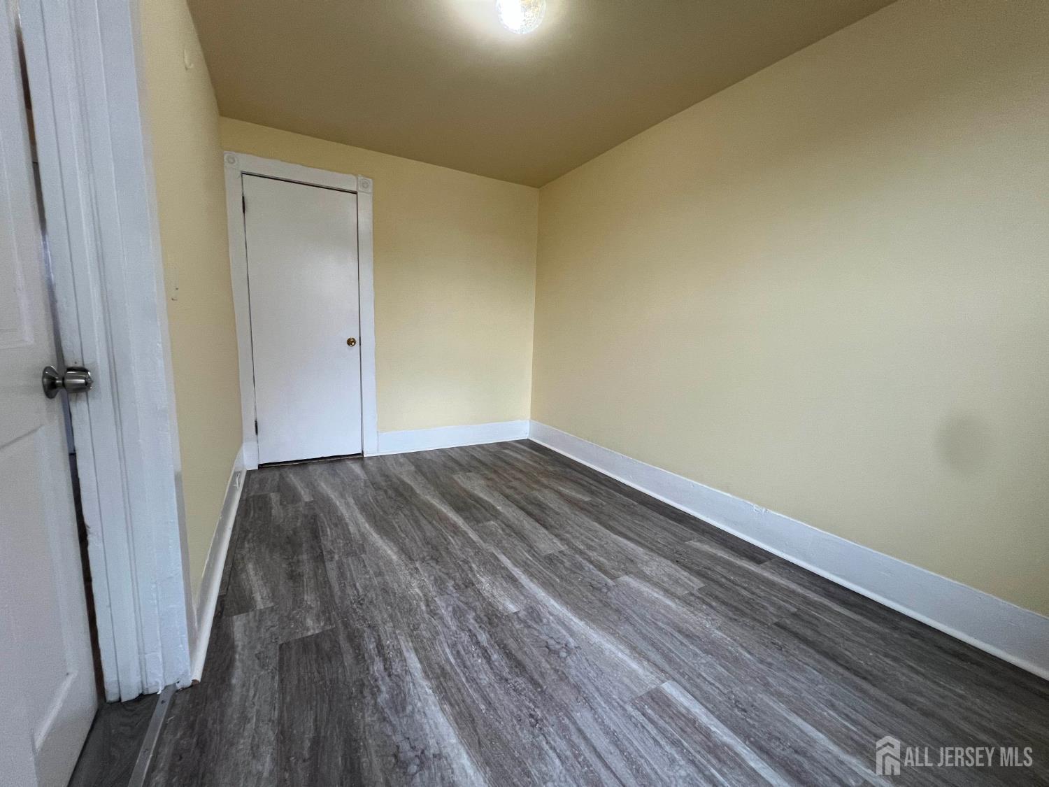 109 Washington Street, Unit 2 Perth Amboy, NJ 08861 - Photo 13 of 15 a view of a room with wooden floor