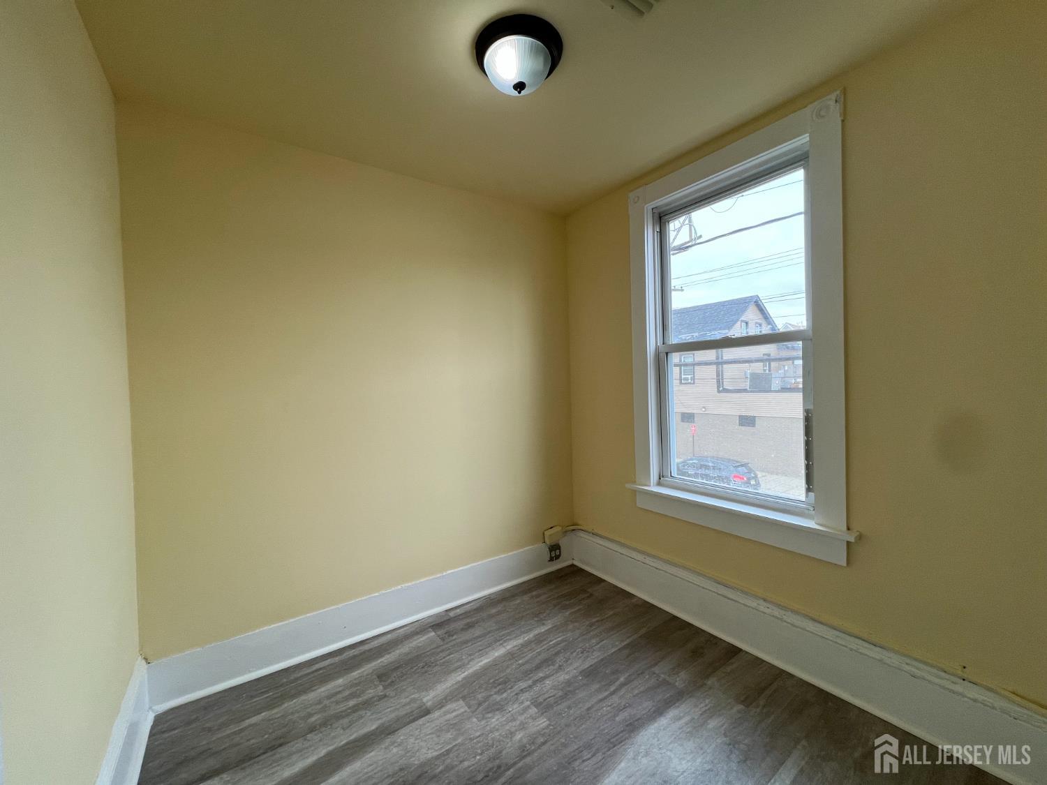 109 Washington Street, Unit 2 Perth Amboy, NJ 08861 - Photo 15 of 15 an empty room with windows
