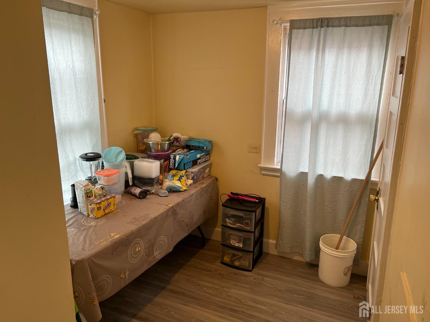 109 Washington Street, Unit 2 Perth Amboy, NJ 08861 - Photo 7 of 12 a room with furniture and a window