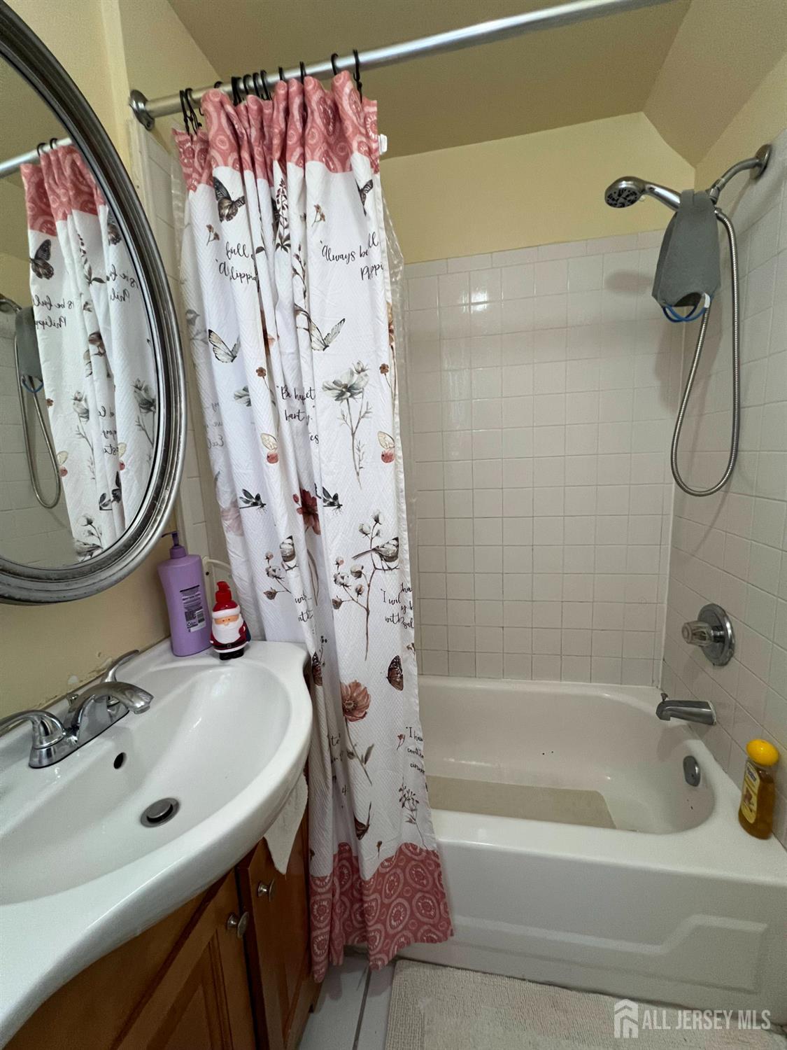 109 Washington Street, Unit 2 Perth Amboy, NJ 08861 - Photo 9 of 12 a bathroom with a sink and a mirror