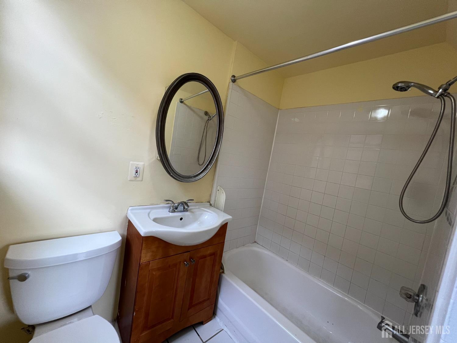 109 Washington Street, Unit 2 Perth Amboy, NJ 08861 - Photo 10 of 15 a bathroom with a sink toilet and shower