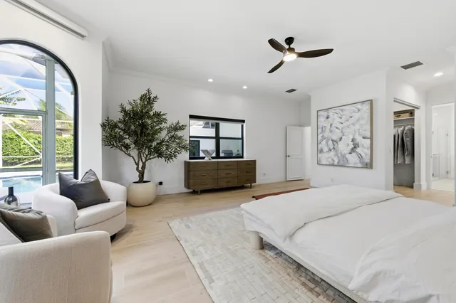 a view of walk in closet and bedroom