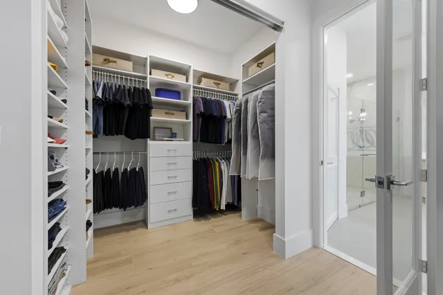 a bathroom with a tub a sink and mirror