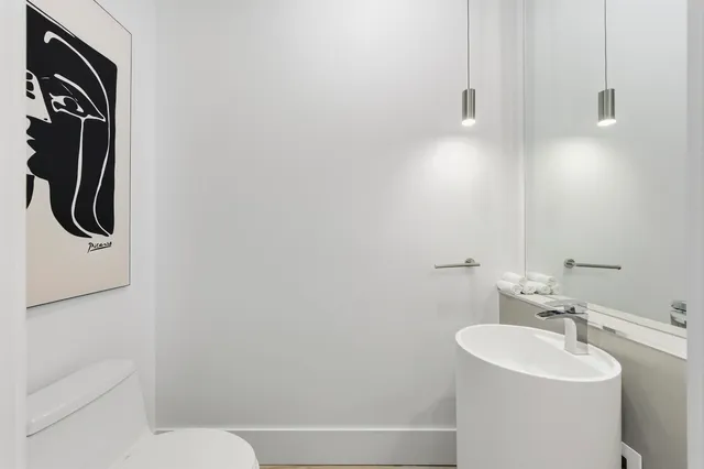 a view of a room with wooden floor and windows