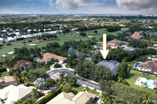 an aerial view of a residential houses with outdoor space
