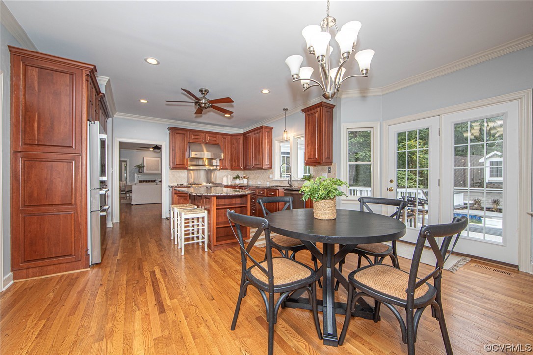 2425 Hartlepool Lane Midlothian, VA 23113 - Photo 18 of 44 a view of a dining room with furniture and wooden floor