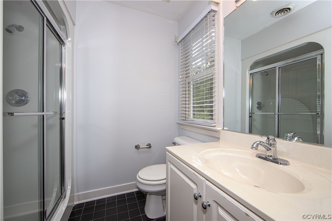 2425 Hartlepool Lane Midlothian, VA 23113 - Photo 27 of 44 a bathroom with a sink toilet and shower