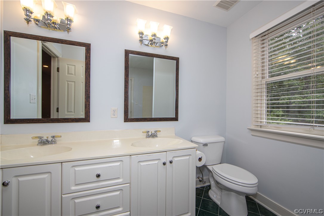 2425 Hartlepool Lane Midlothian, VA 23113 - Photo 31 of 44 a bathroom with a granite countertop toilet sink and mirror