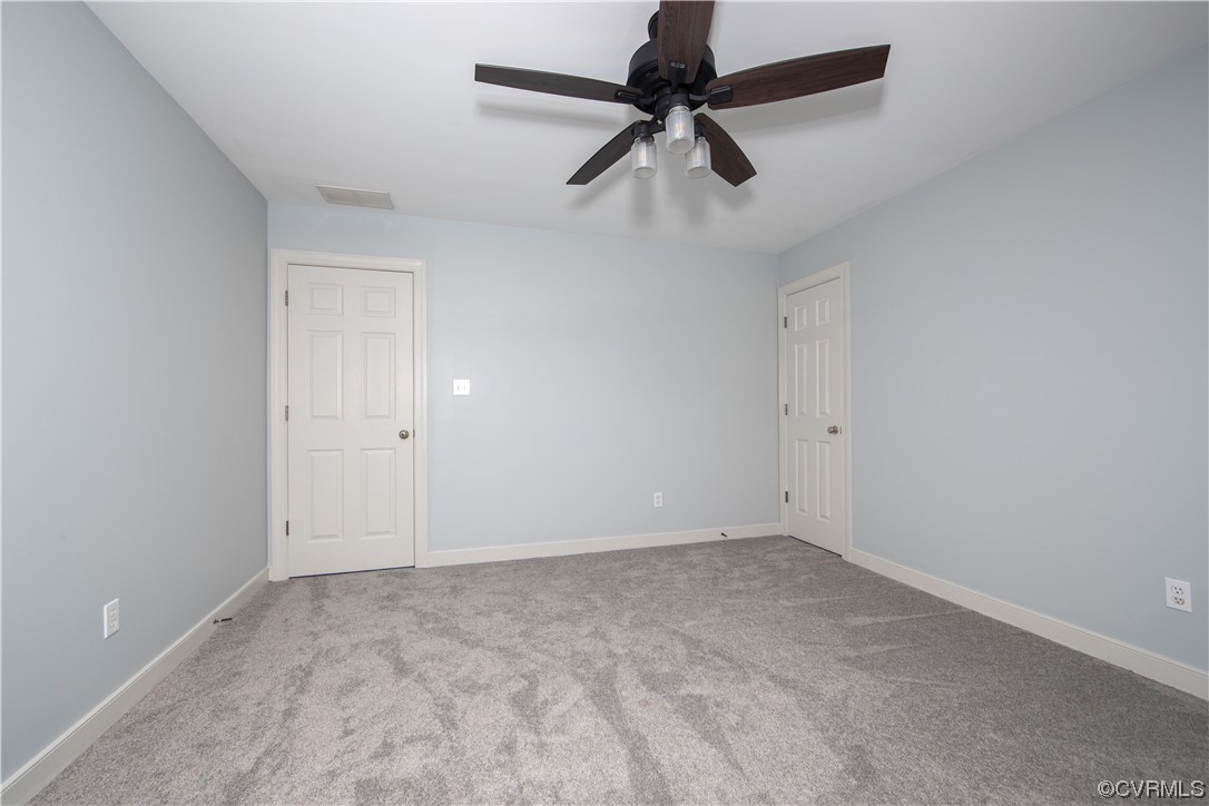 2425 Hartlepool Lane Midlothian, VA 23113 - Photo 32 of 44 an empty room with a ceiling fan and window