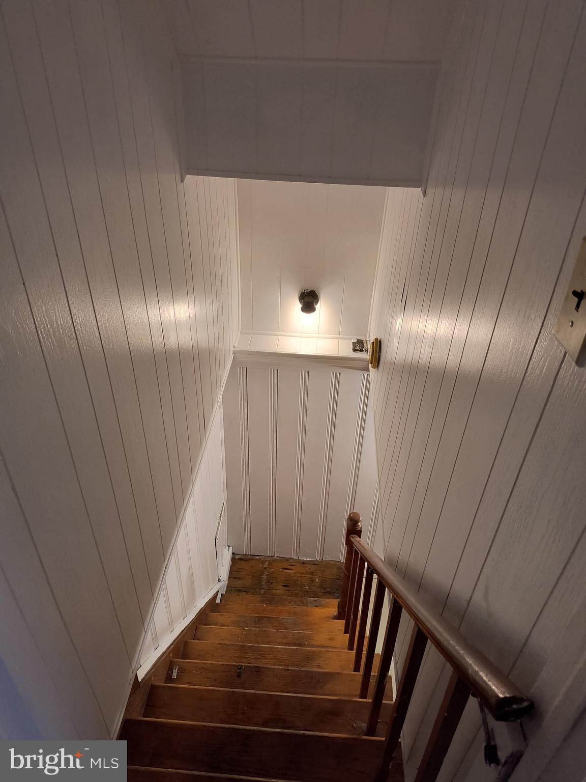 4101 Marx Avenue Baltimore, MD 21206 - Photo 11 of 19 a view of staircase with wooden floor