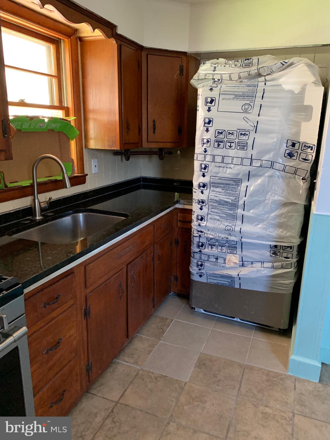4101 Marx Avenue Baltimore, MD 21206 - Photo 11 of 42 a kitchen with granite countertop a sink and a stove