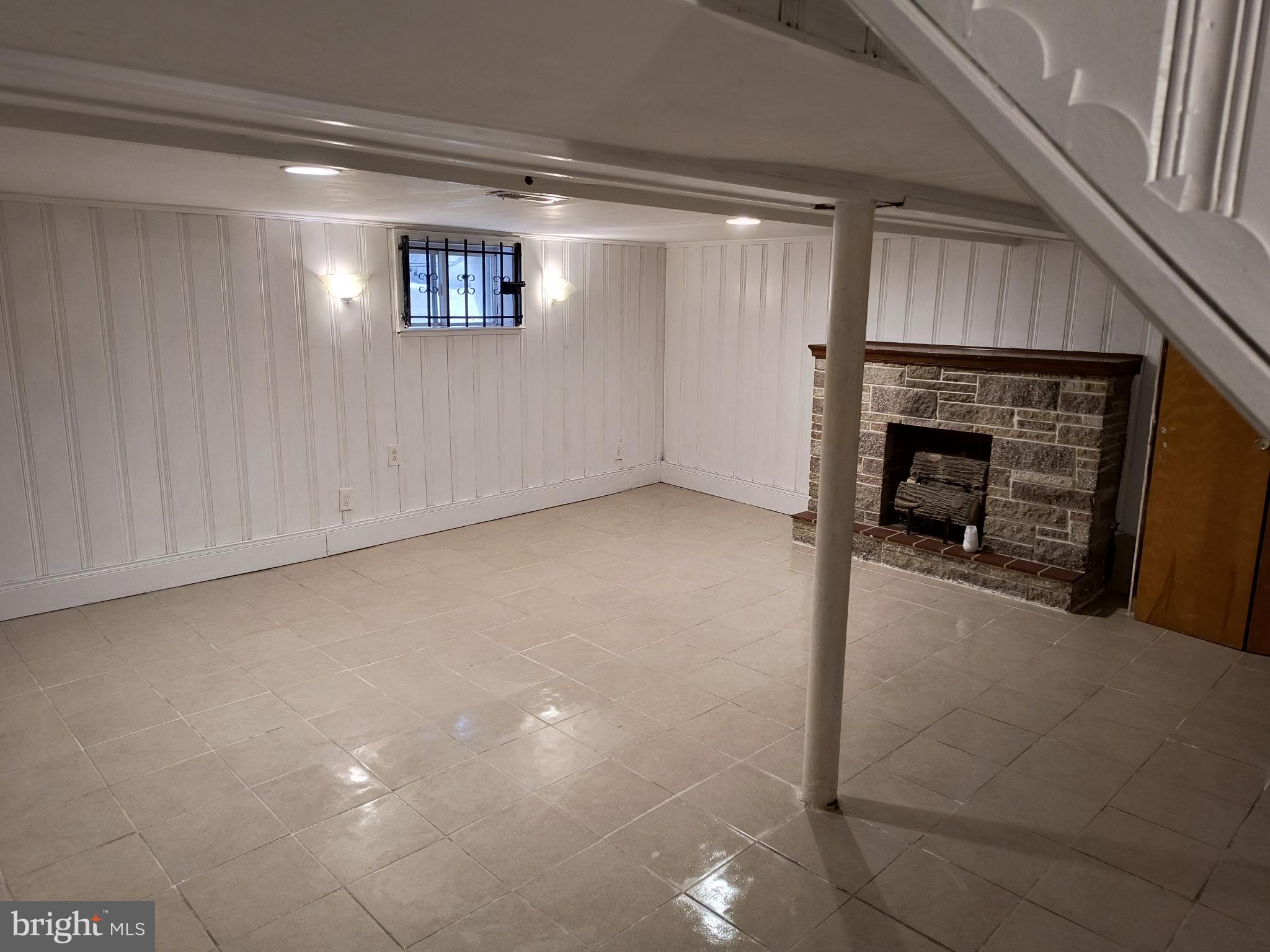 4101 Marx Avenue Baltimore, MD 21206 - Photo 13 of 19 a view of an empty room with fireplace and a window