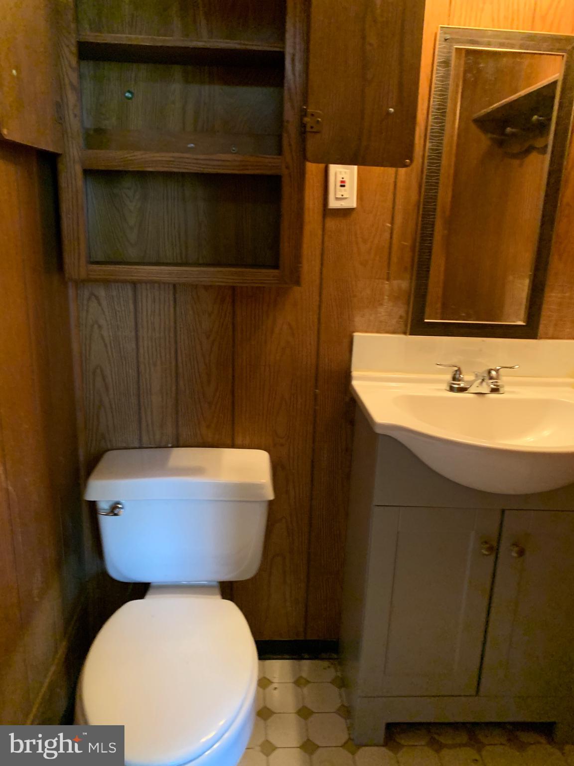 4101 Marx Avenue Baltimore, MD 21206 - Photo 15 of 42 a bathroom with a toilet sink and mirror