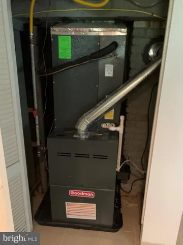 a view of an empty room with a fireplace