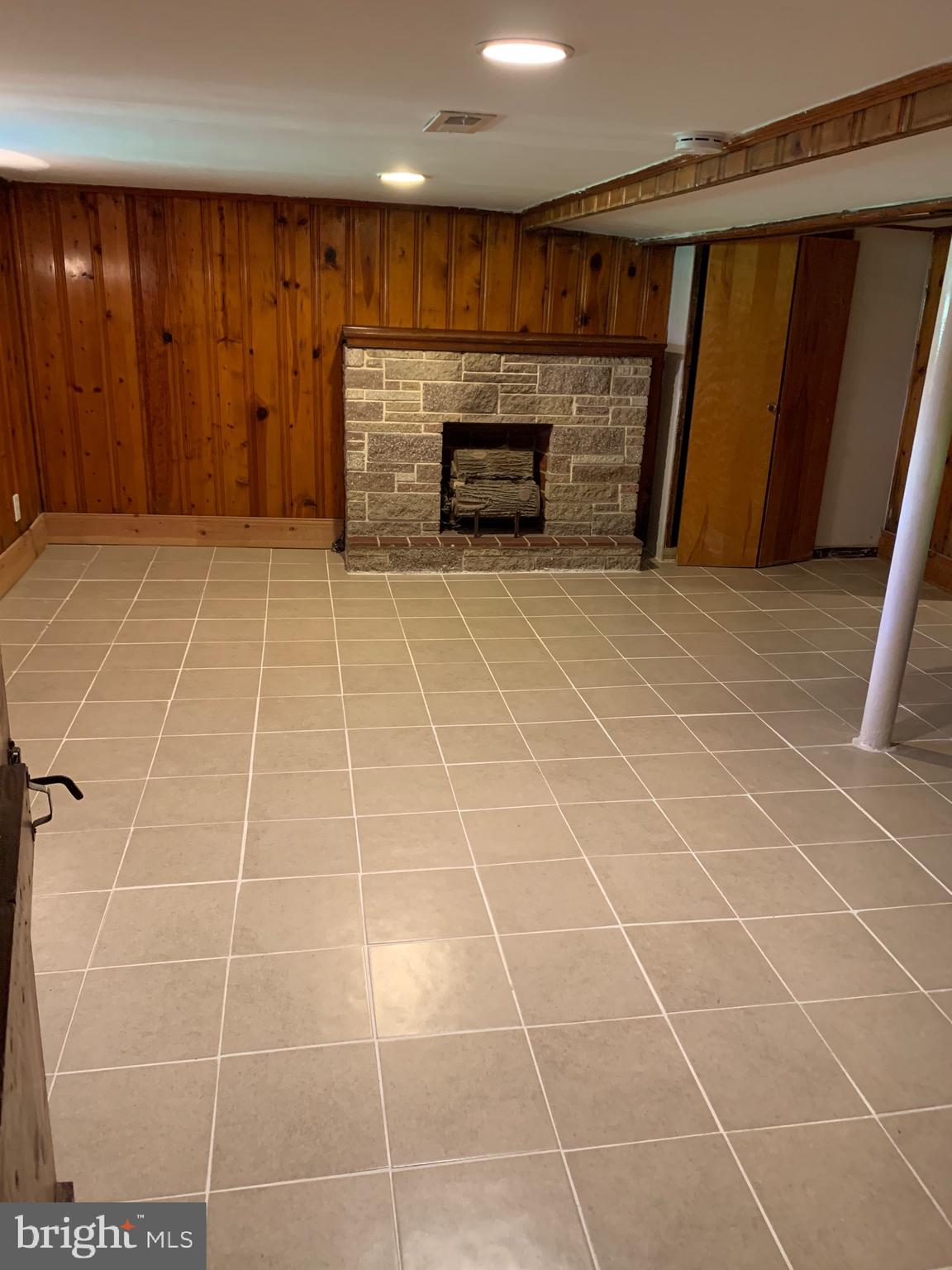 4101 Marx Avenue Baltimore, MD 21206 - Photo 25 of 42 a view of an empty room with a fireplace