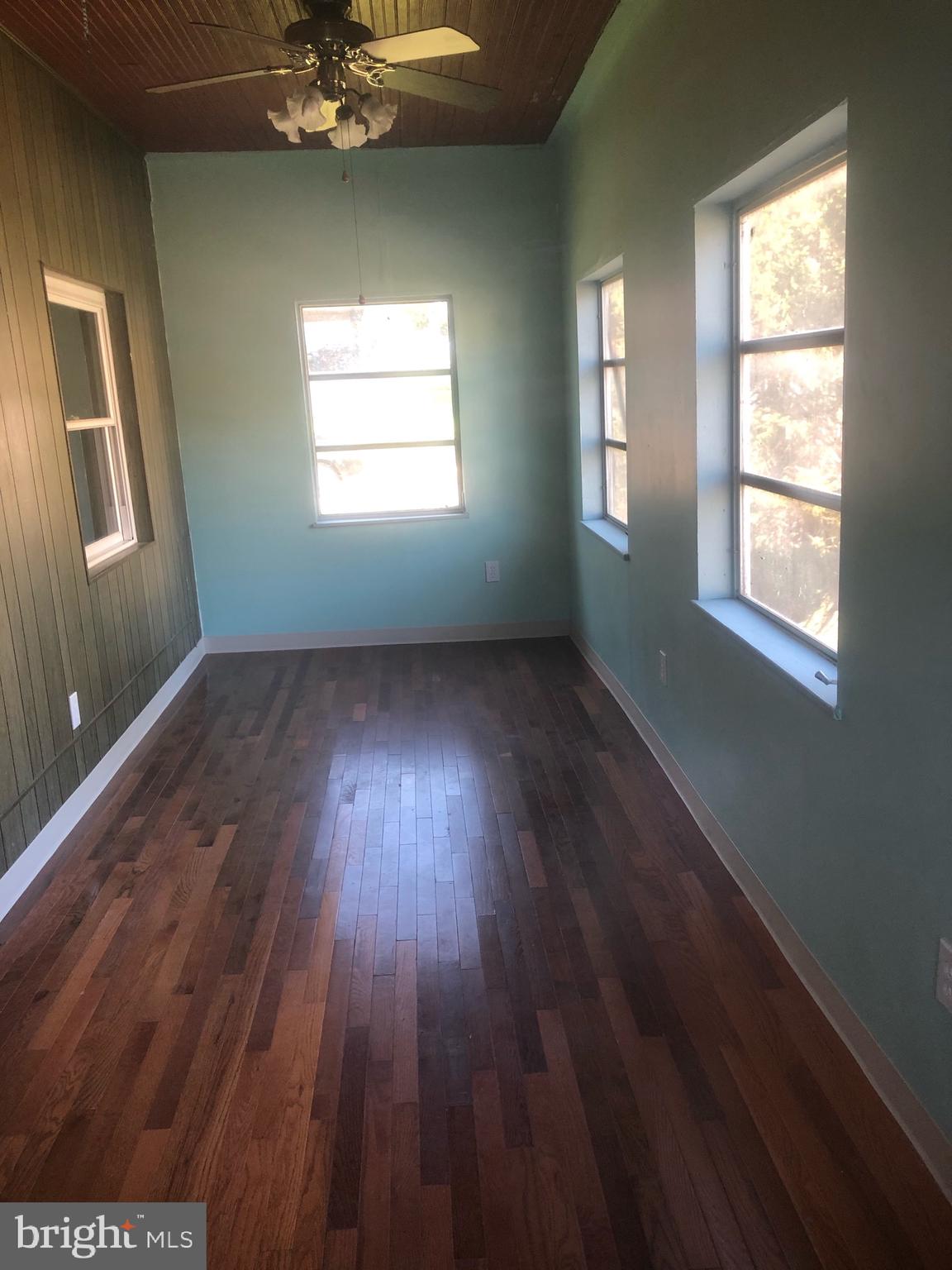 4101 Marx Avenue Baltimore, MD 21206 - Photo 39 of 42 a view of an empty room with wooden floor and a window