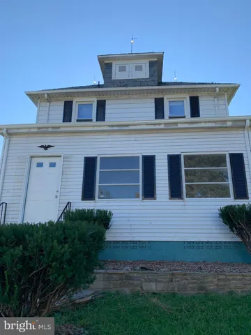 a view of a house with a garden