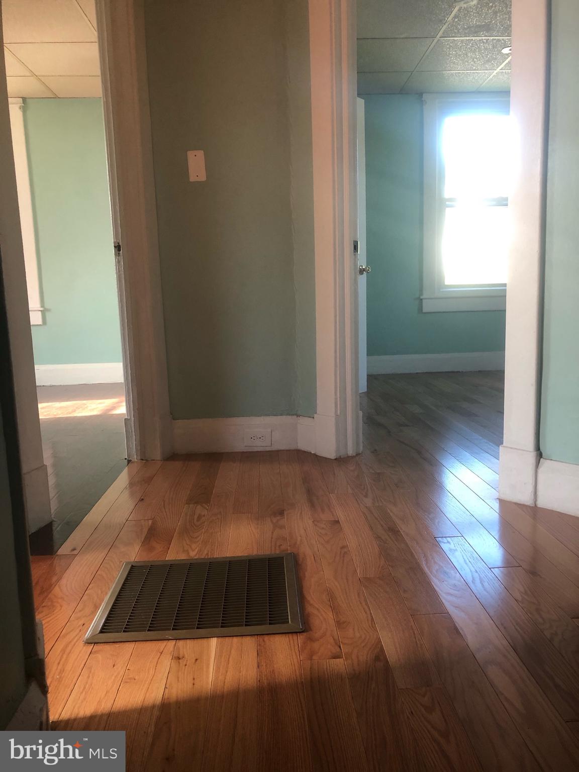 4101 Marx Avenue Baltimore, MD 21206 - Photo 41 of 42 wooden floor in an empty room with a window