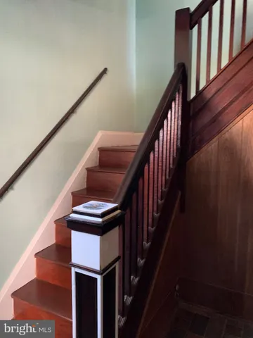 a kitchen with stainless steel appliances kitchen island granite countertop a stove and a sink