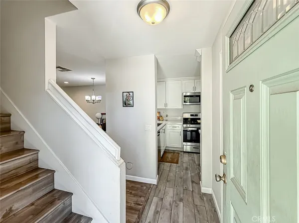 a view of a kitchen from the hallway