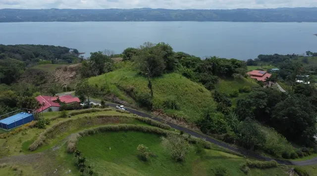 a aerial view of a houses with a lake view