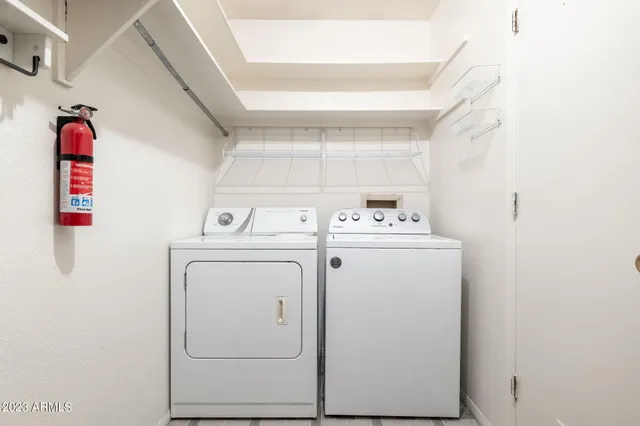 a utility room with dryer and washer