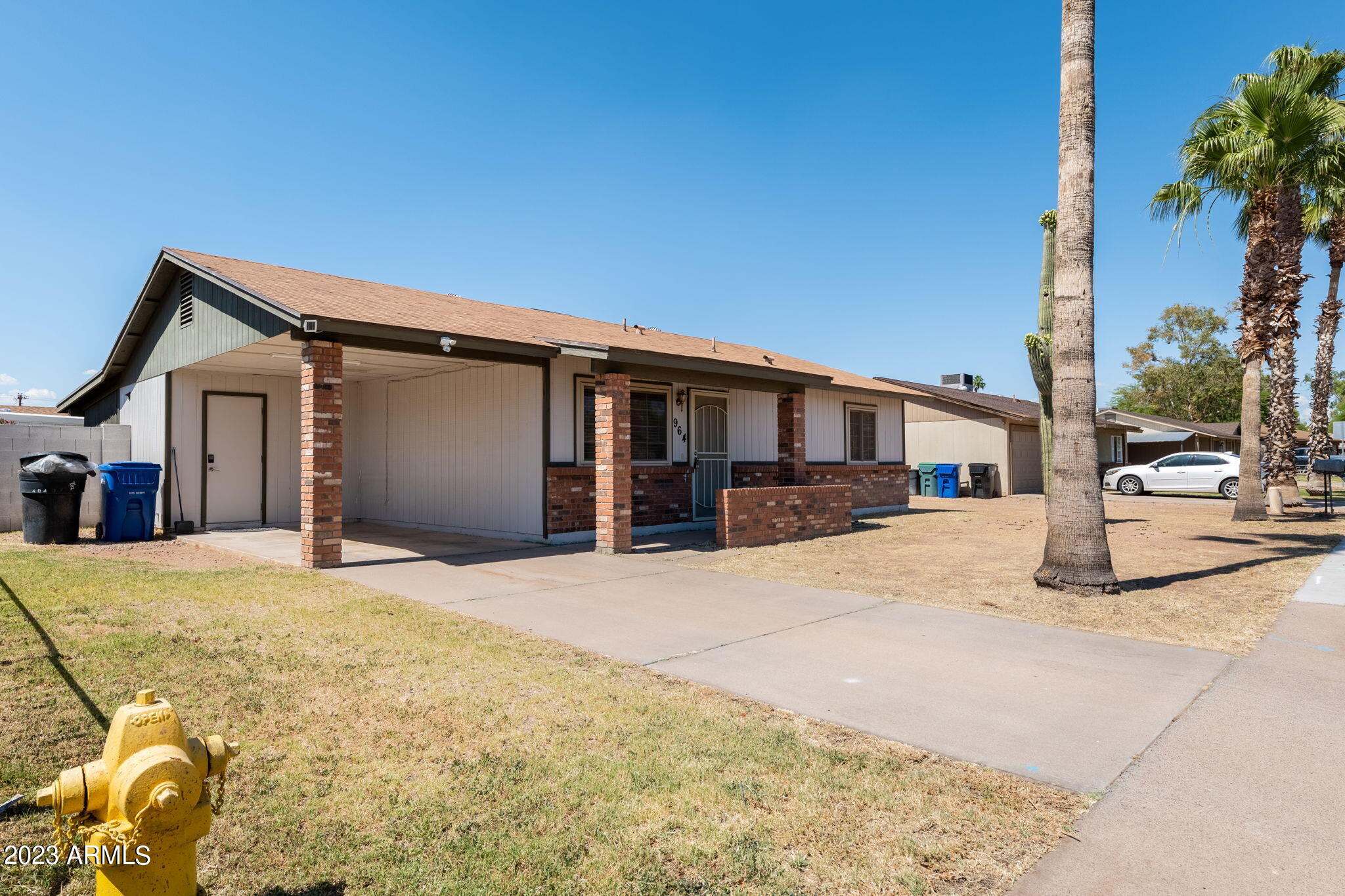 964 West Hackamore Street Mesa, AZ 85201 - Photo 2 of 24 a front view of a house with a yard