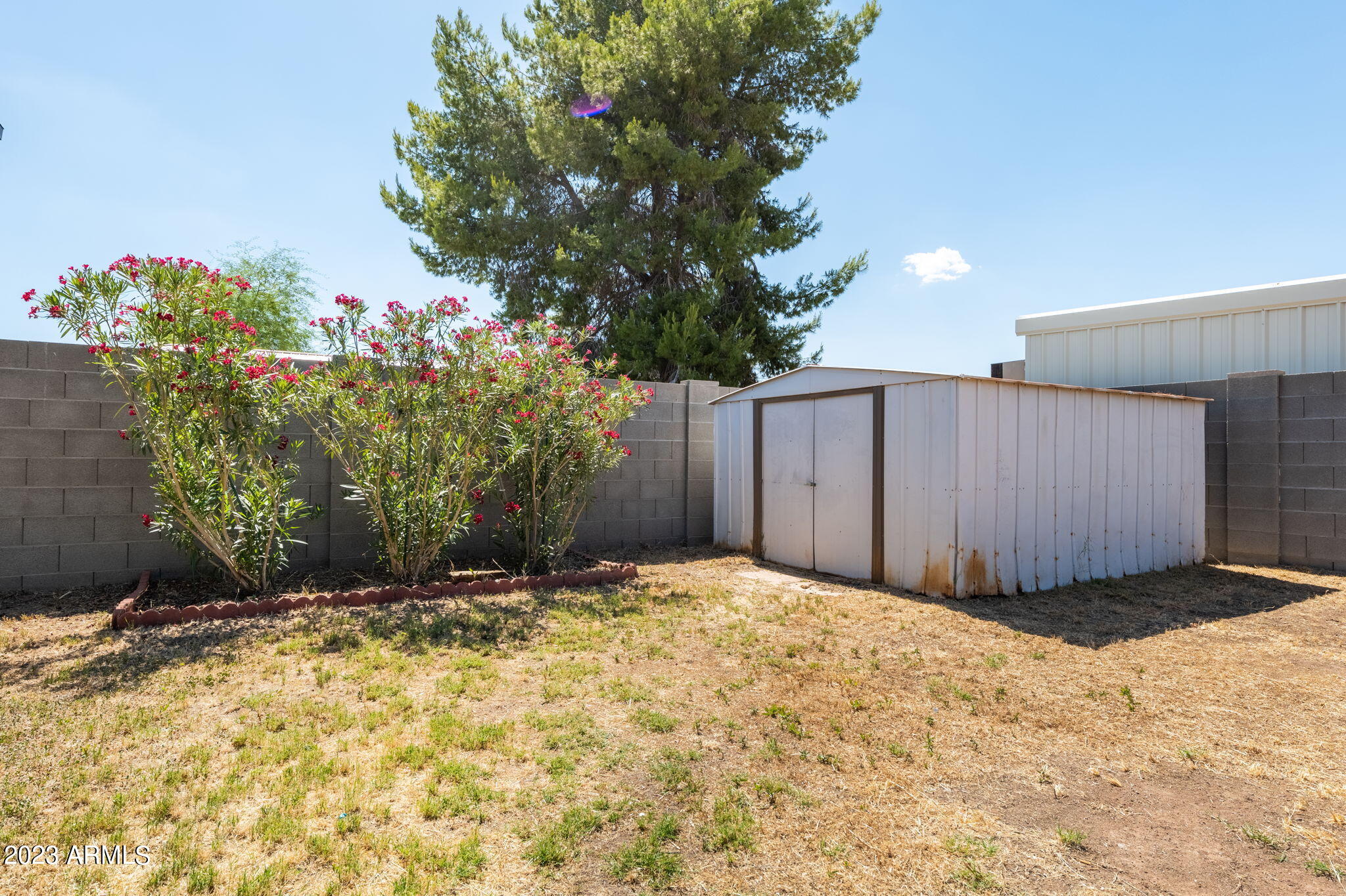 964 West Hackamore Street Mesa, AZ 85201 - Photo 24 of 24 a view of a garage with a house