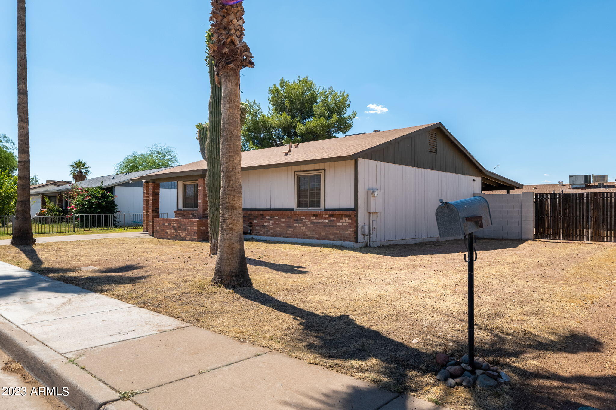 964 West Hackamore Street Mesa, AZ 85201 - Photo 3 of 24 a front view of a house with a yard