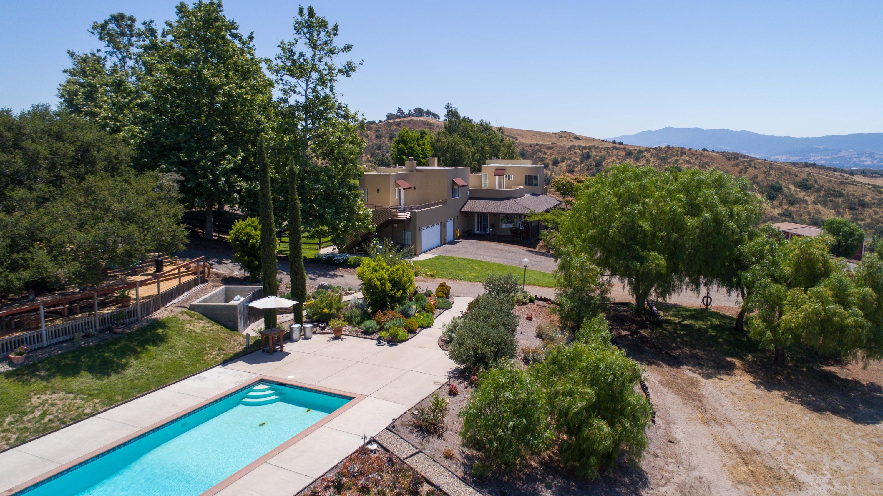 an aerial view of a house with a garden