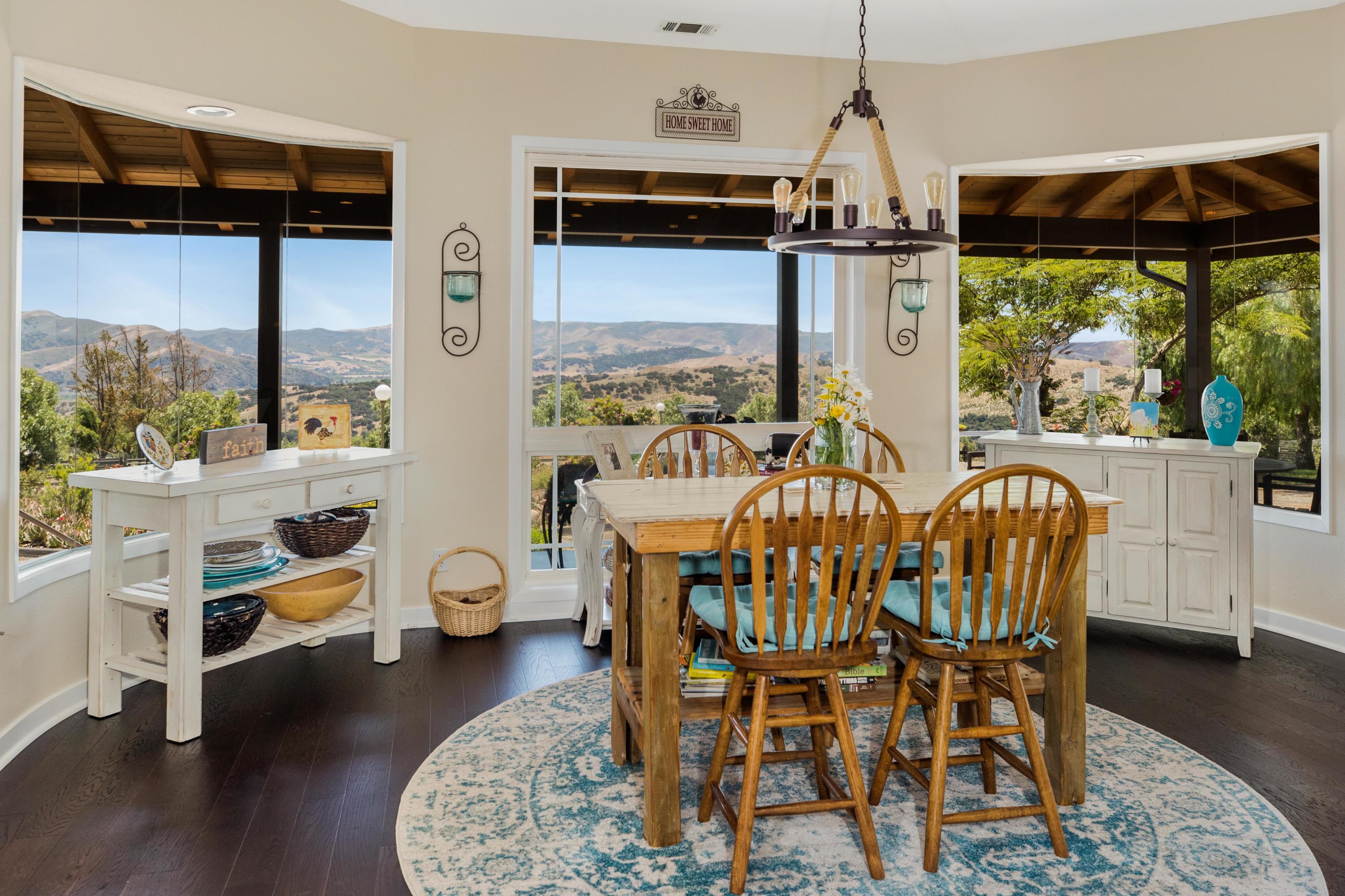 1833 Cougar Ridge Road Buellton, CA 93427 - Photo 13 of 49 a view of a dining room with furniture window and wooden floor