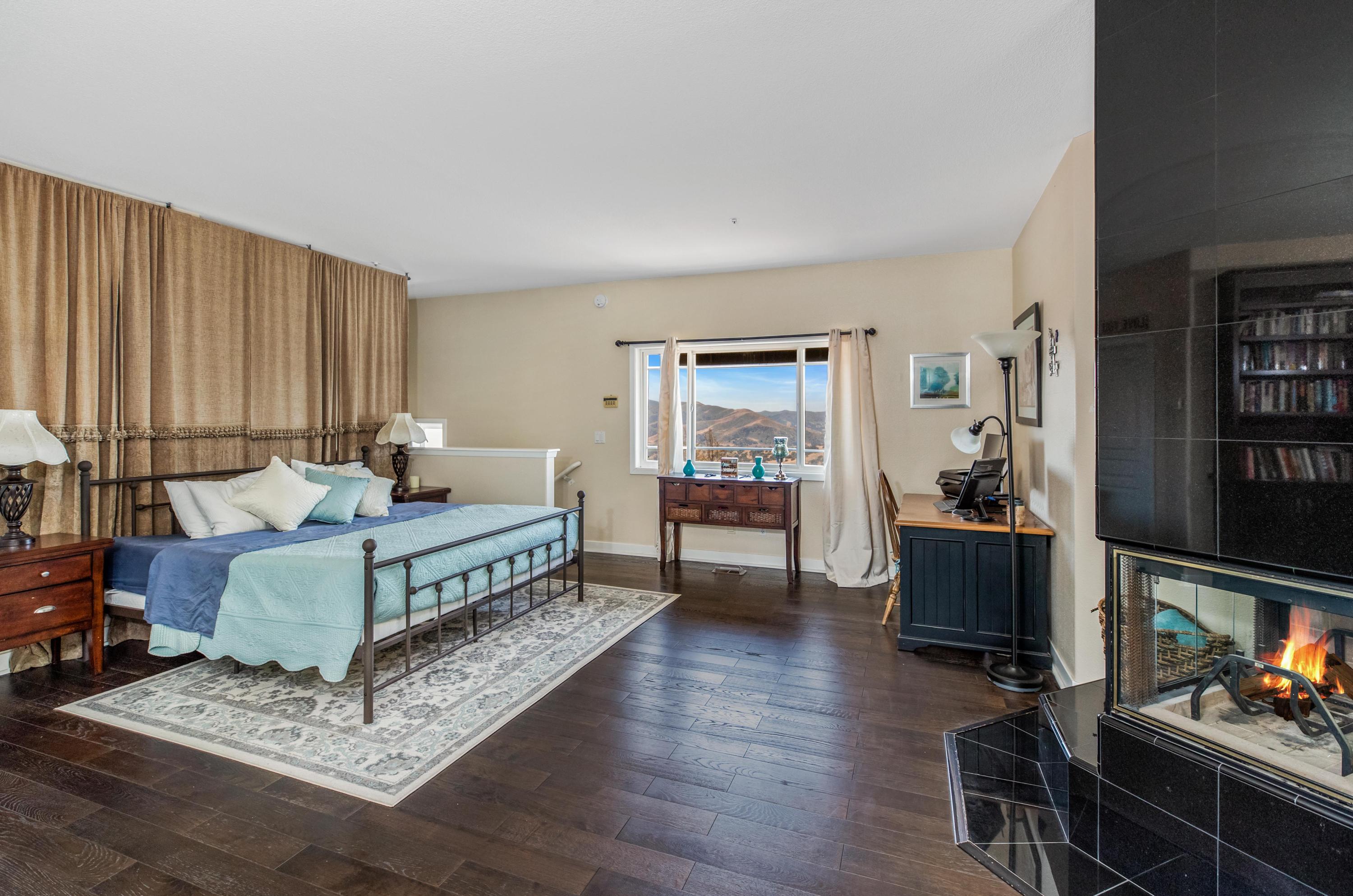 1833 Cougar Ridge Road Buellton, CA 93427 - Photo 15 of 49 a living room with furniture a rug and a window