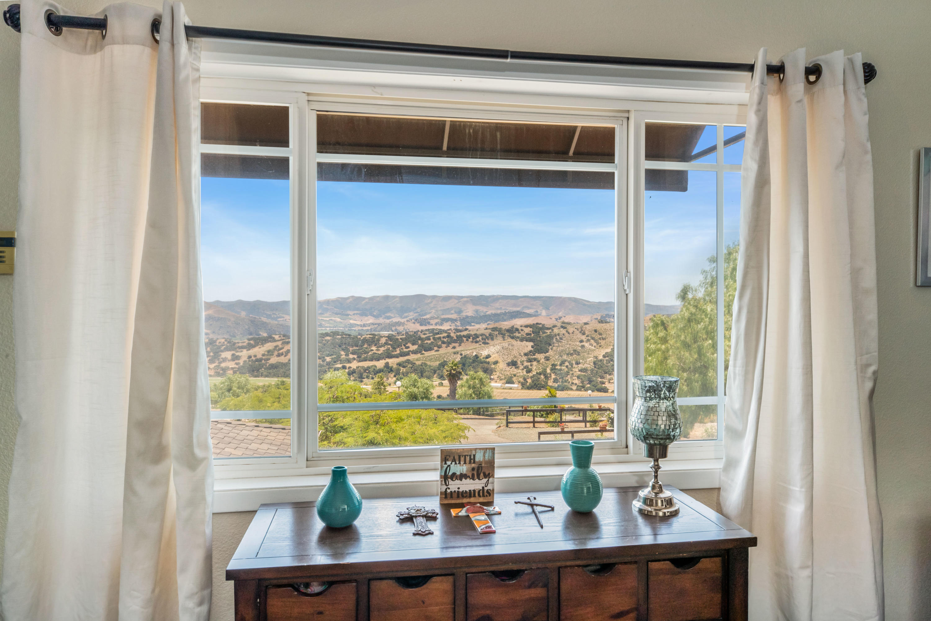 1833 Cougar Ridge Road Buellton, CA 93427 - Photo 17 of 49 a view of a room with a large window and wooden floor