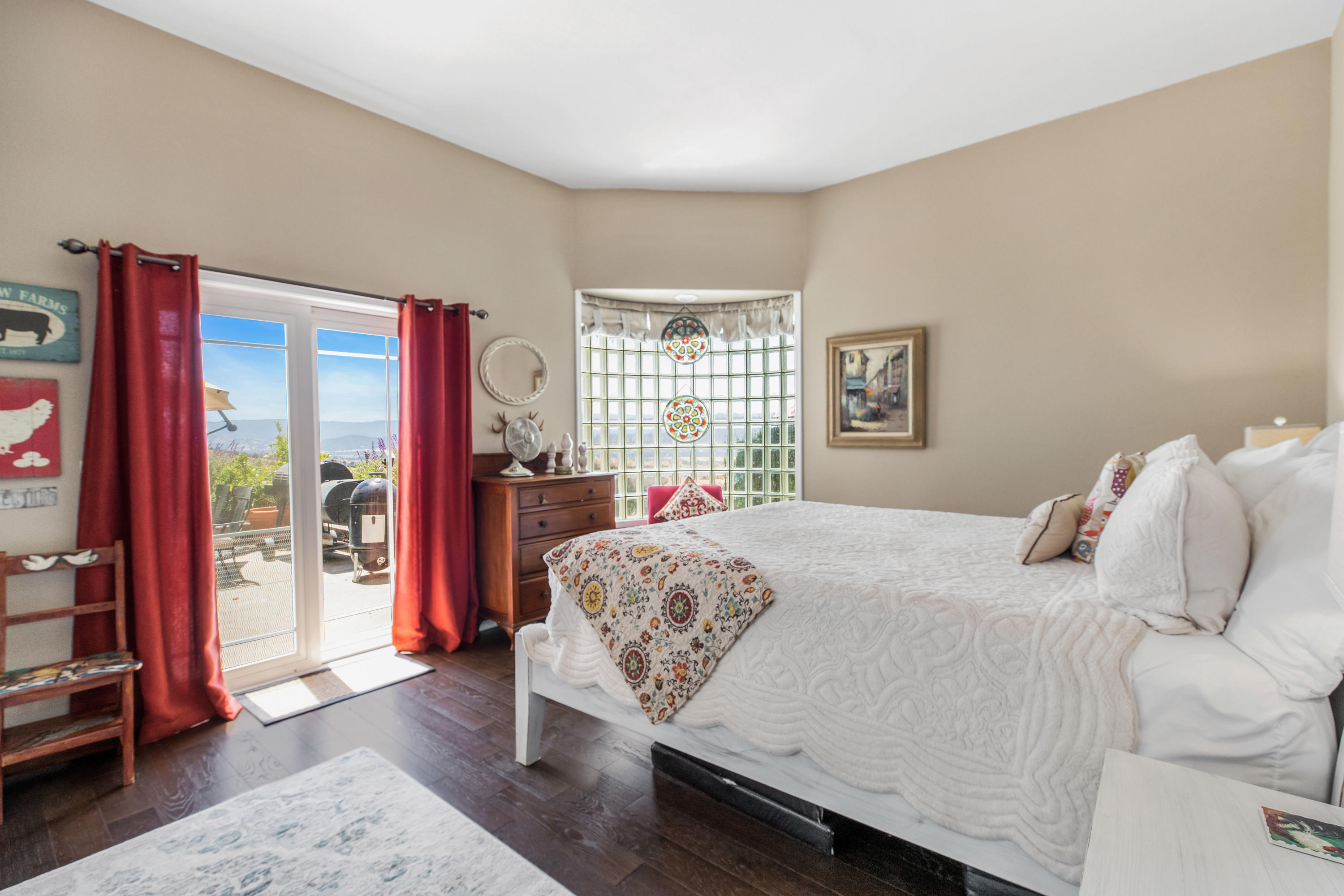 1833 Cougar Ridge Road Buellton, CA 93427 - Photo 20 of 49 a bedroom with a large bed and a large window