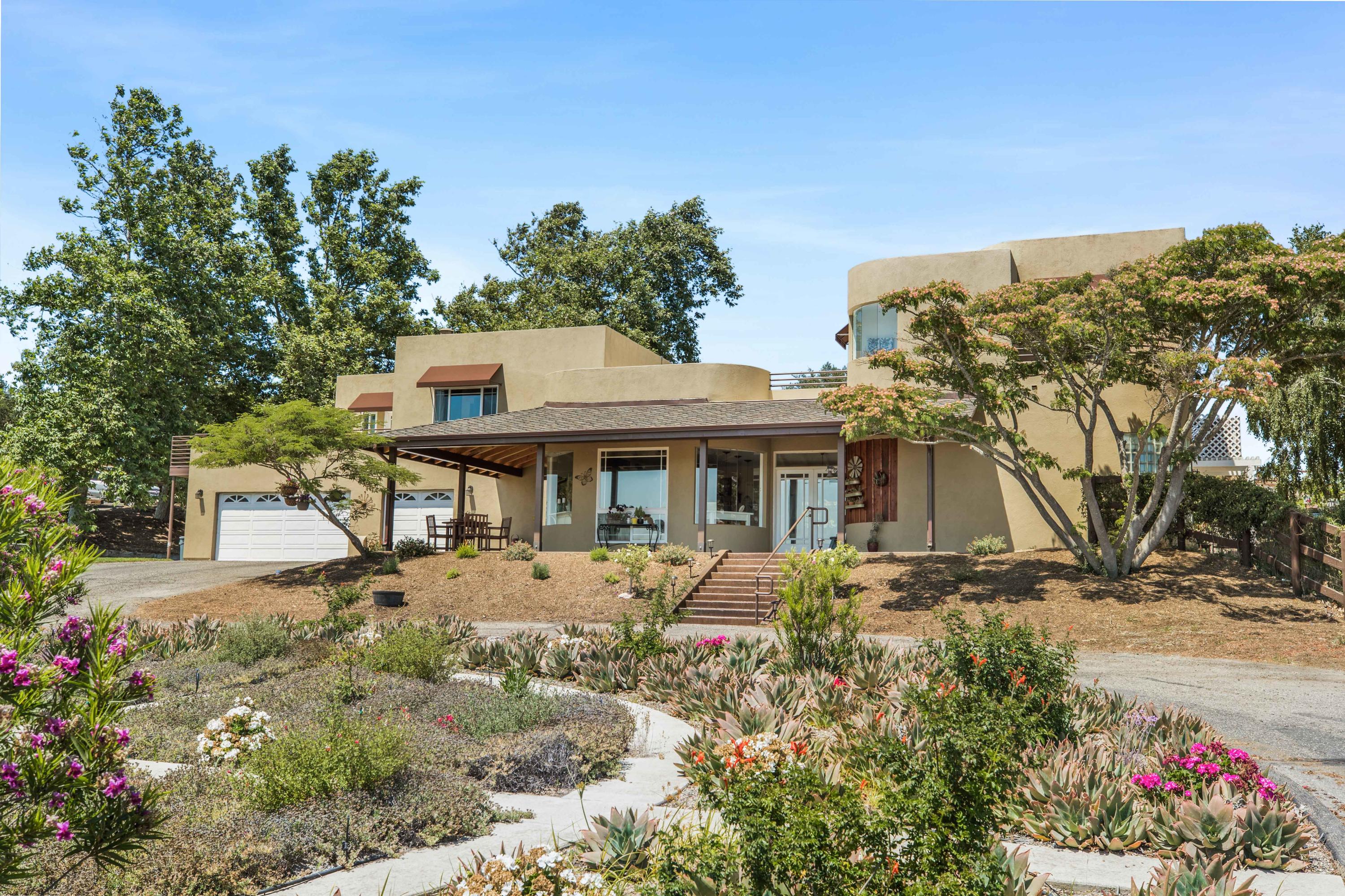 1833 Cougar Ridge Road Buellton, CA 93427 - Photo 2 of 49 a front view of a house with a yard