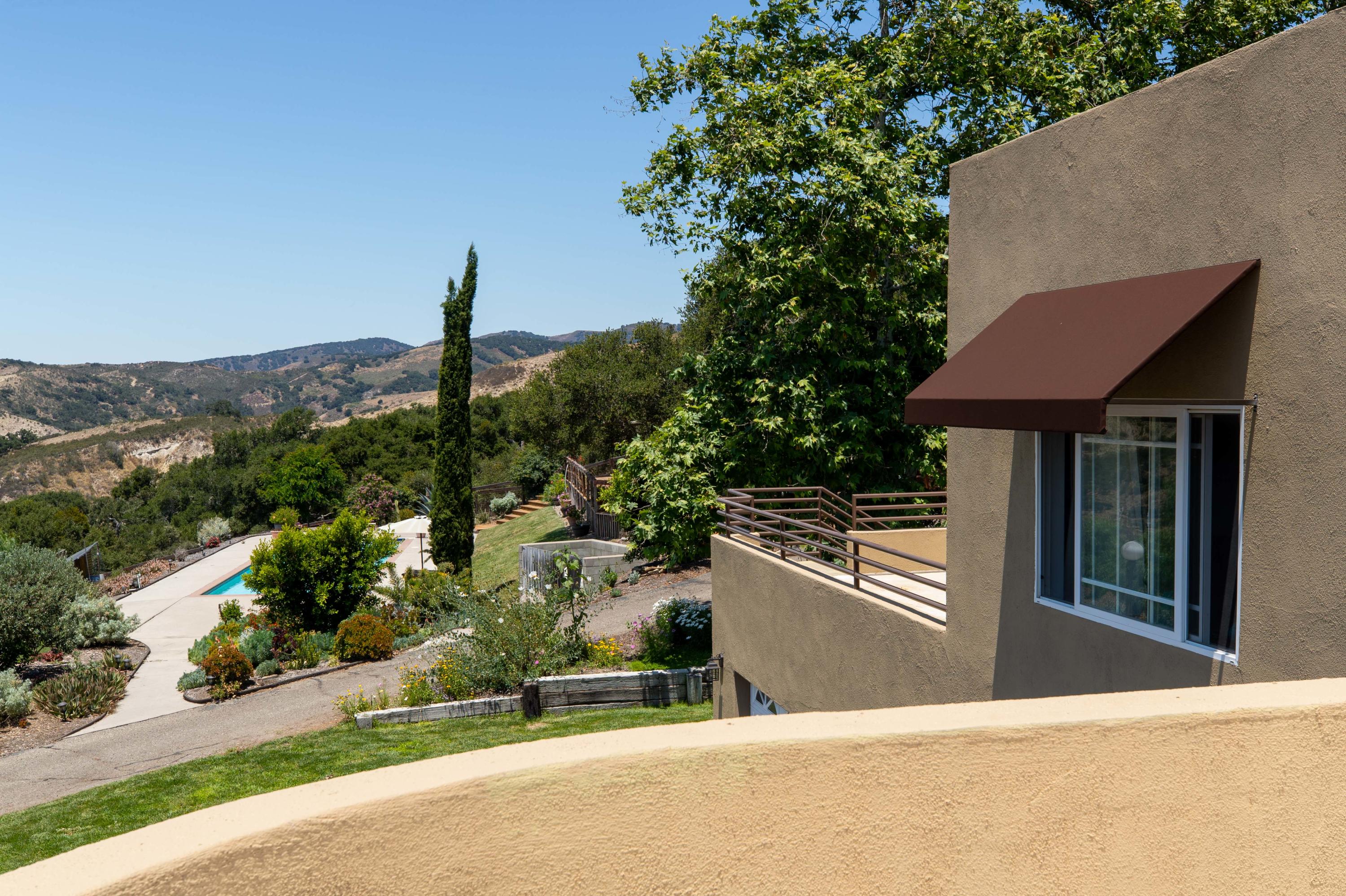 1833 Cougar Ridge Road Buellton, CA 93427 - Photo 25 of 49 a view of a house with a backyard and a tree