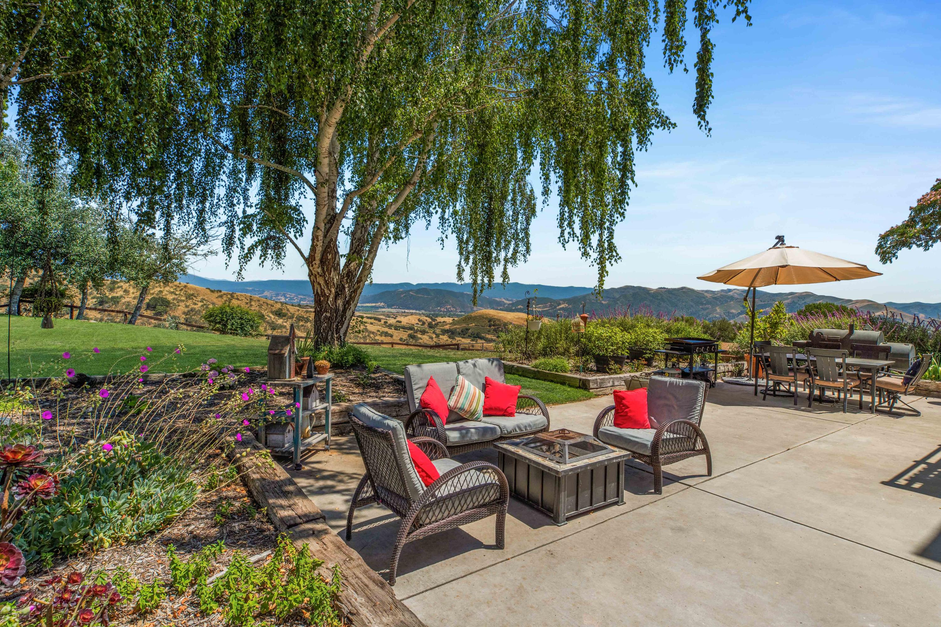 1833 Cougar Ridge Road Buellton, CA 93427 - Photo 34 of 49 an outdoor space with furniture and umbrella