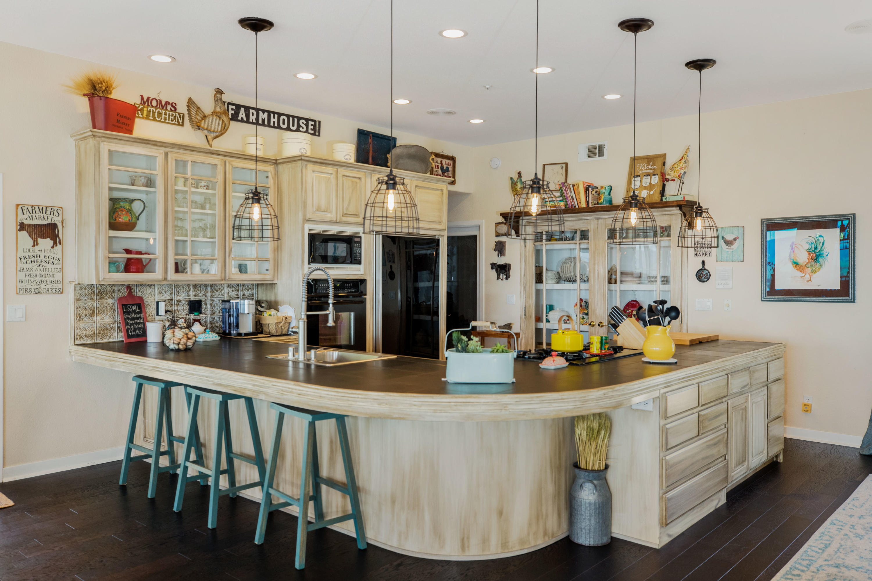 1833 Cougar Ridge Road Buellton, CA 93427 - Photo 10 of 49 a kitchen with stainless steel appliances granite countertop a stove and white cabinets